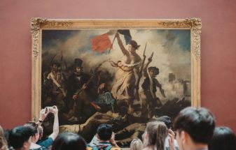 Two Activists Detained for Placing Posters Around "Liberty Leading The People" Painting at Louvre